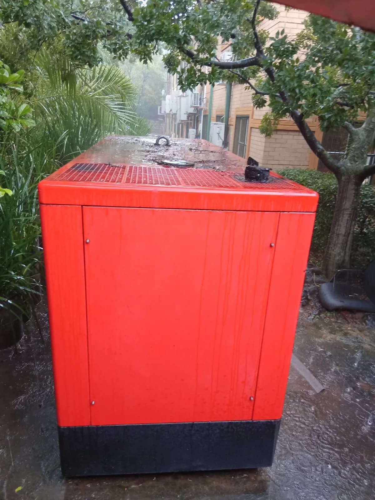 Two technicians diagnosing a standby generator