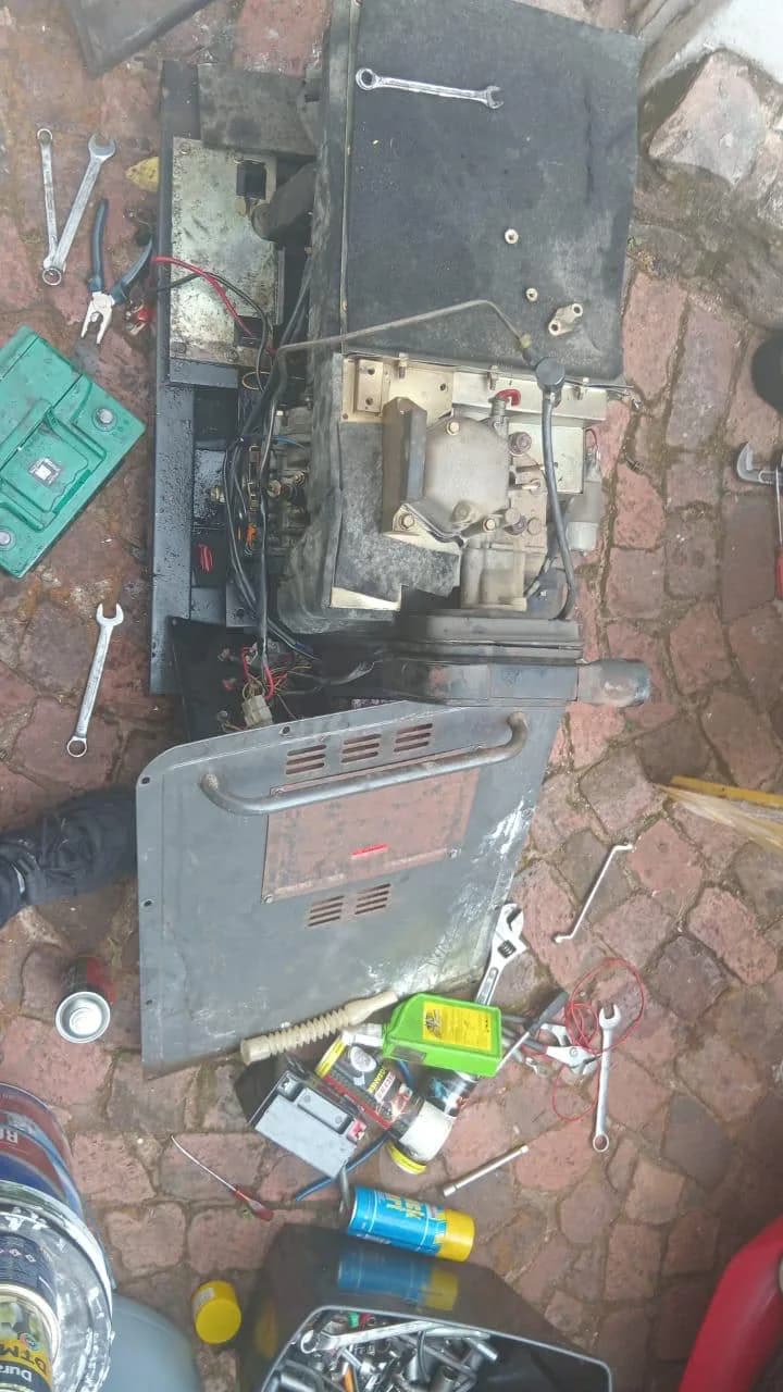 Technicians inspecting injector lines on a diesel generator