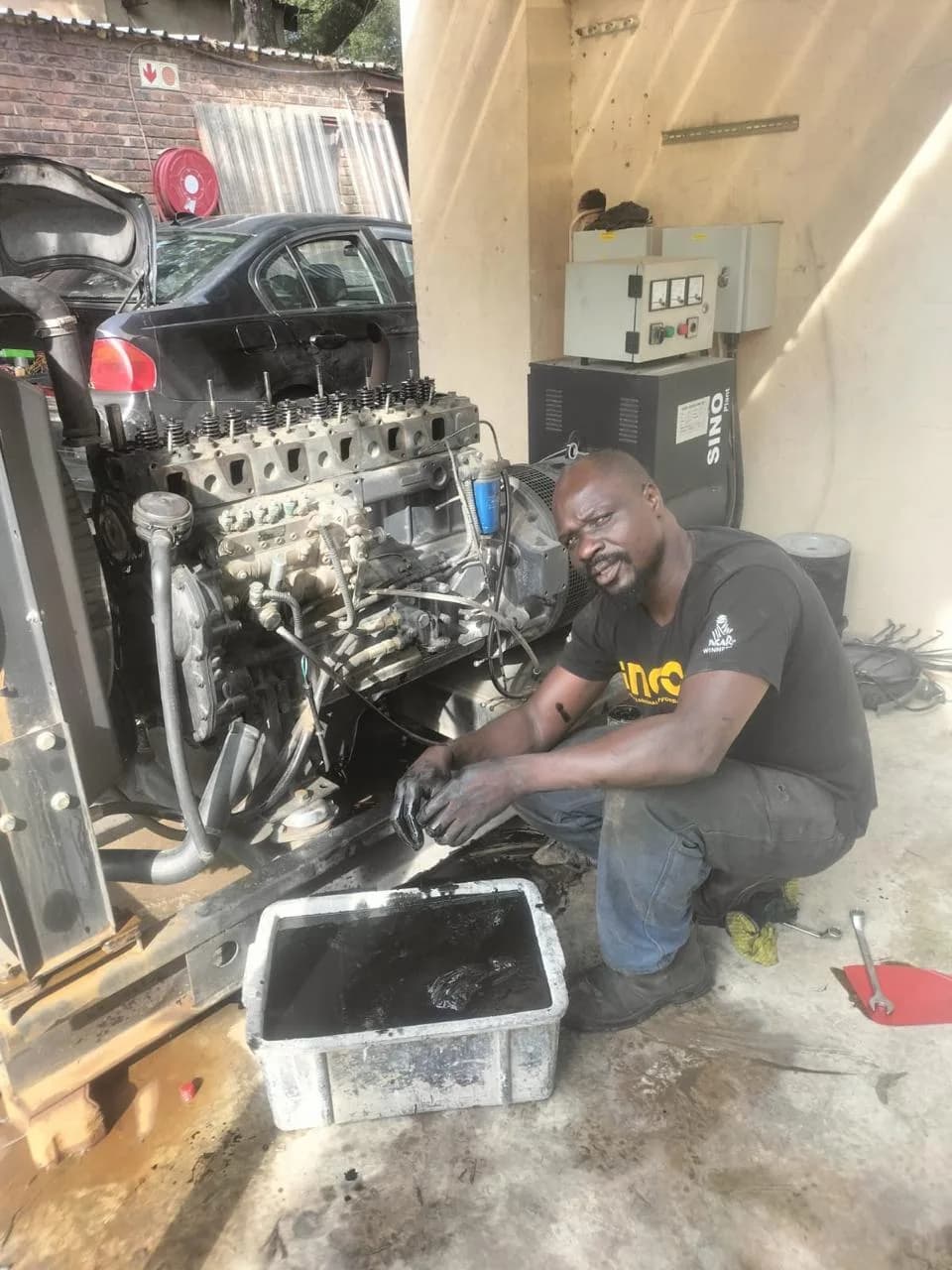 Two technicians inspecting a commercial generator