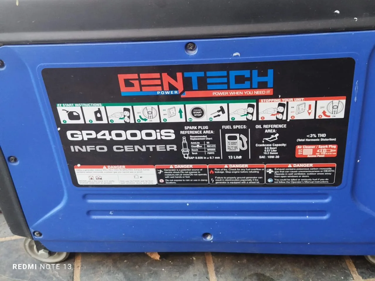 Gentech portable petrol generator being inspected