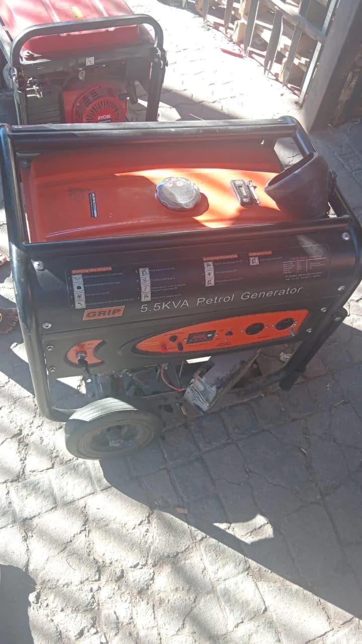 Grip portable petrol generator being inspected