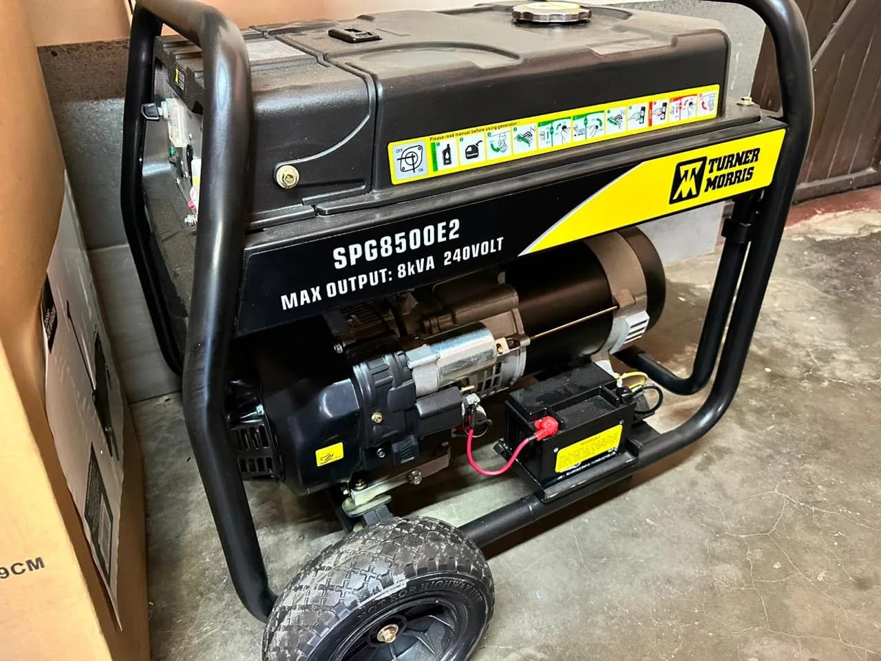 PowerBoss portable petrol generator being inspected