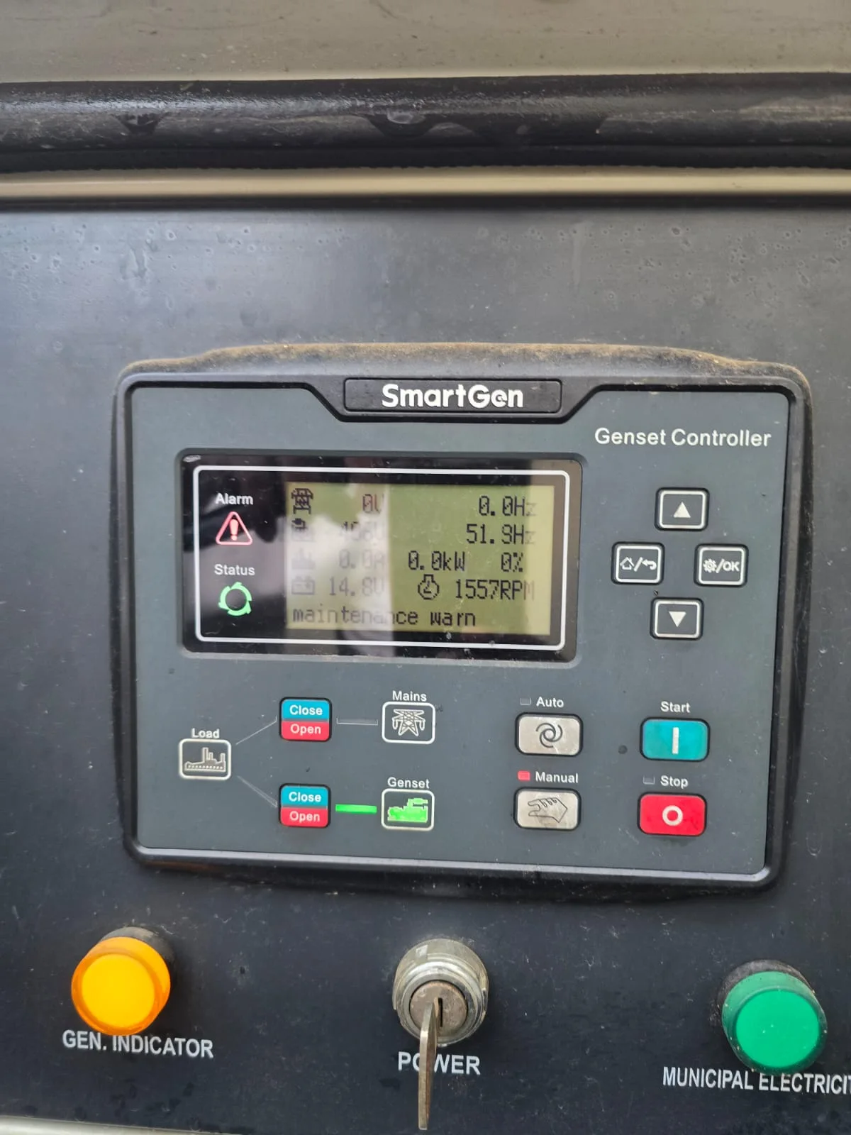 Technician connecting a laptop to a generator controller during setup