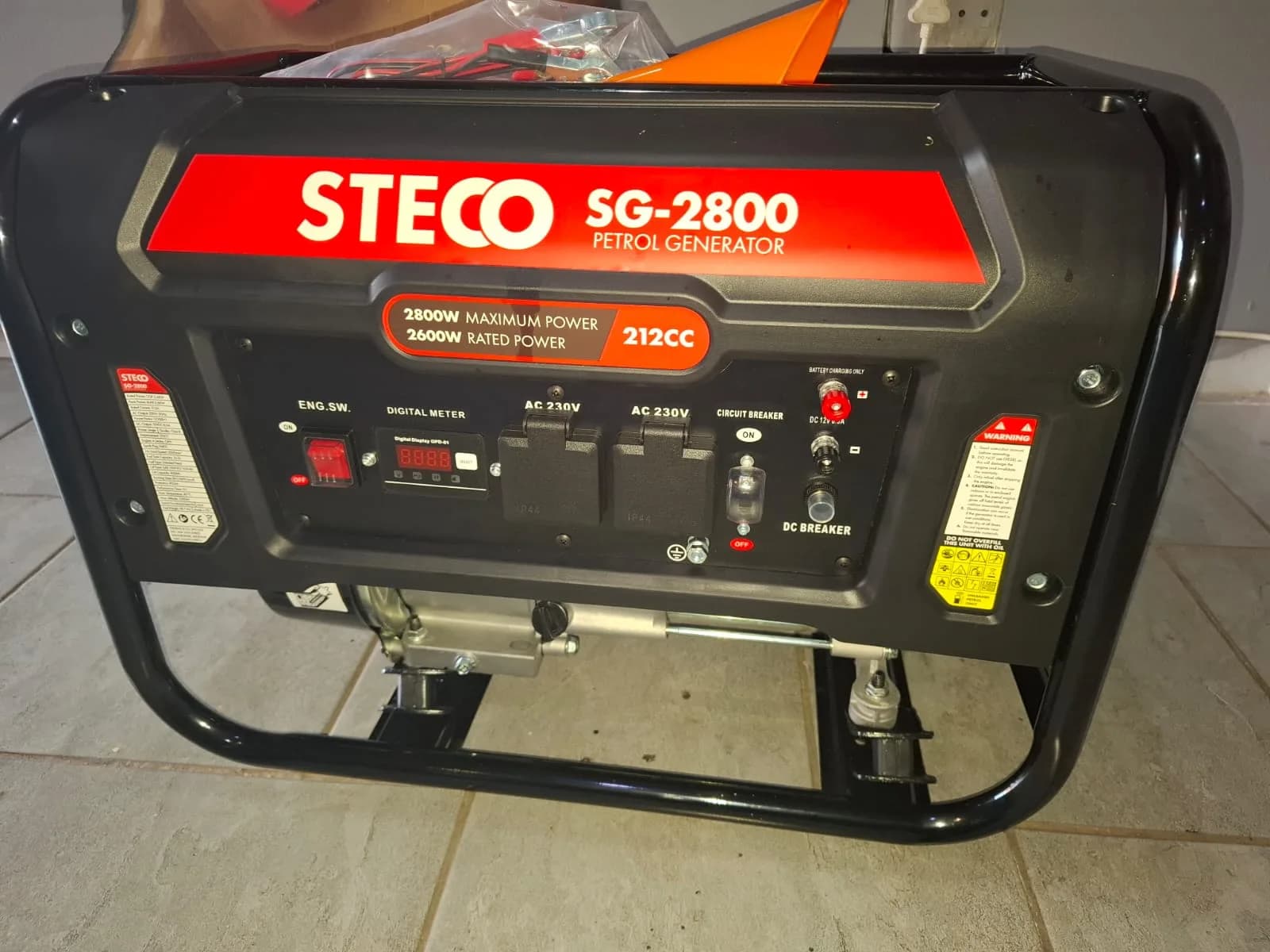 Steco portable petrol generator being inspected