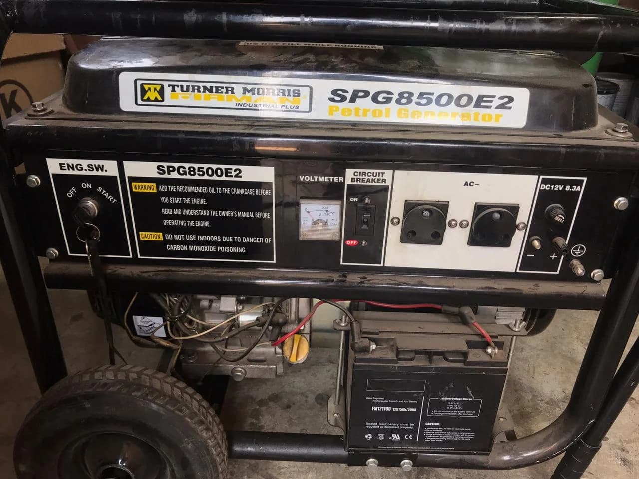 Turner Morris portable petrol generator being inspected